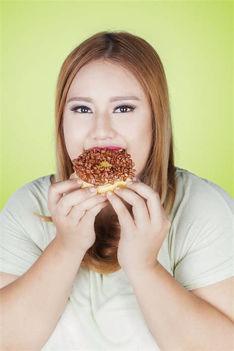 Overweight Woman Eating Donut In Hand Stock Image Image Of Junk Calories