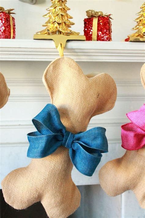 Three Teddy Bears With Bows Hanging From Hooks On A Fireplace Mantel In