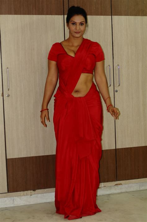 Telugu Actress Apoorva Aunty Hot In Red Saree Exposing Navel With Huge Boobs