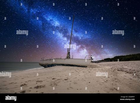 Milky Way In The Night Sky Over A Shipwreck Off The Coast Of Clam Pass