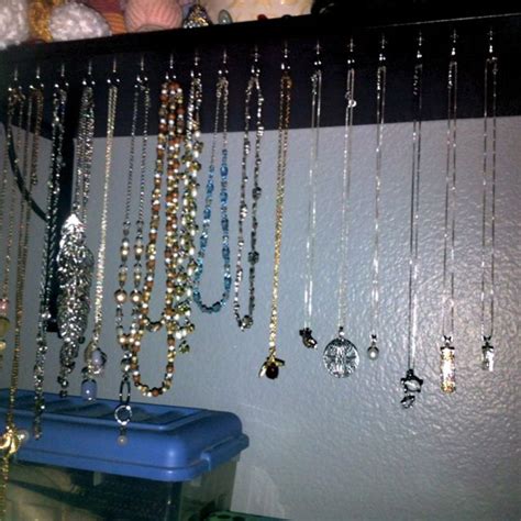 Shelf Mounted To The Wall With Hooks For A Nice Necklace Organizer And
