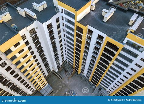 Aerial View Of Tall Apartment Building Complex Blue Flat Roof With