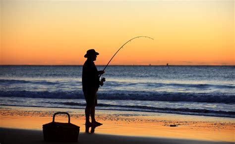 Beach Fishing At Sunset Queensland Australia