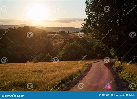 Sunset A Winding Road Leading Into The Sunset Stock Image Image Of