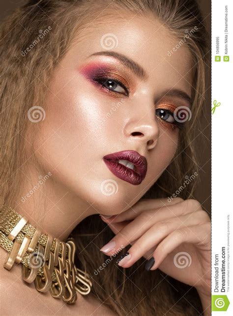 Beautiful Blond Model Curls Bright Makeup Gold Jewelry