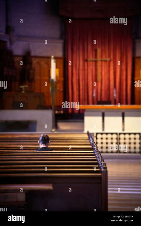 Praying In Church Stock Photo Alamy
