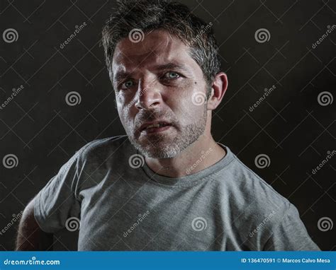 Isolated Dark Background Portrait Of Young Upset And Defiant Man In