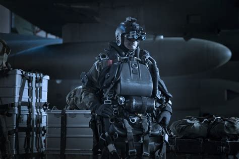 Us Navy Seal Equipped With Night Vision Prepares For Halo Jump