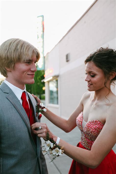 Teenage Couple Dressed Up For High School Prom Having Fun Before The