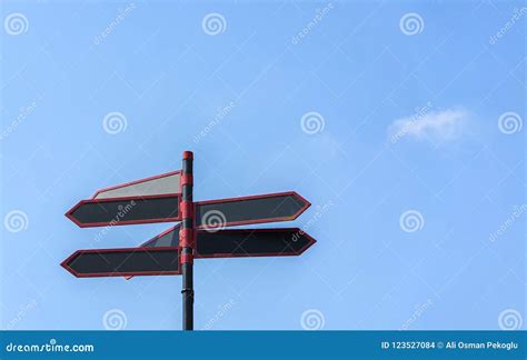 Blank Directional Road Signs Against Blue Sky Black Red Arrows On The
