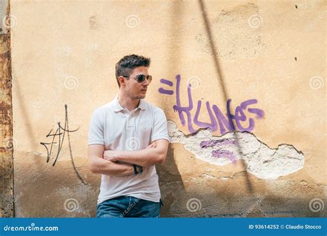Young Man Leaning Against The Wall Stock Photo Image Of Leaning