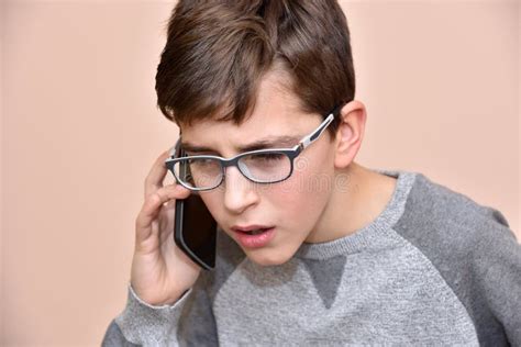 Young Boy Talking On His Smart Phone Stock Image Image Of Holding