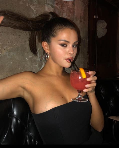 selena gomez nearly pops out of sexy top in new photos but fans think star looks completely
