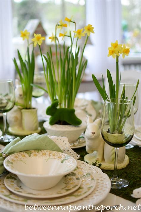 Easter Table Setting With Daffodil And Moss Centerpiece