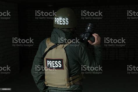 Photojournalist In A Helmet And Flak Jacket Stock Photo Download