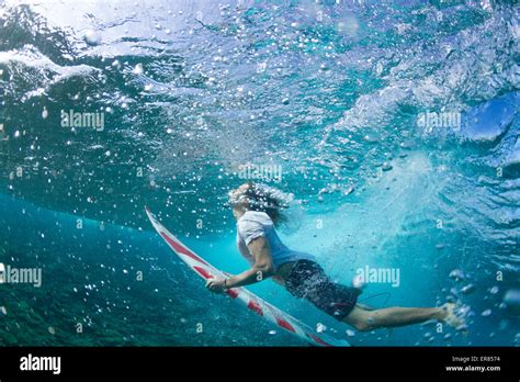 Underwater View Of A Surfer Duck Diving Under A Wave Stock Photo Alamy