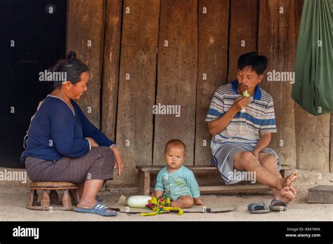 Thakhek Laos April Local Lao Family Sitting In Front Of Their Wooden House In A
