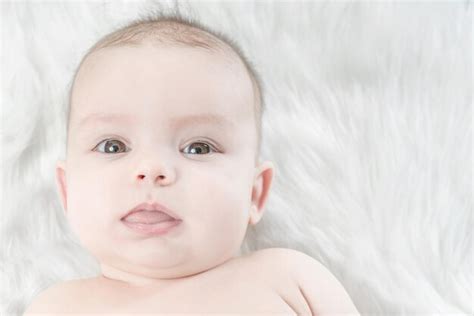 Premium Photo Cute Baby Lying On A White Fur