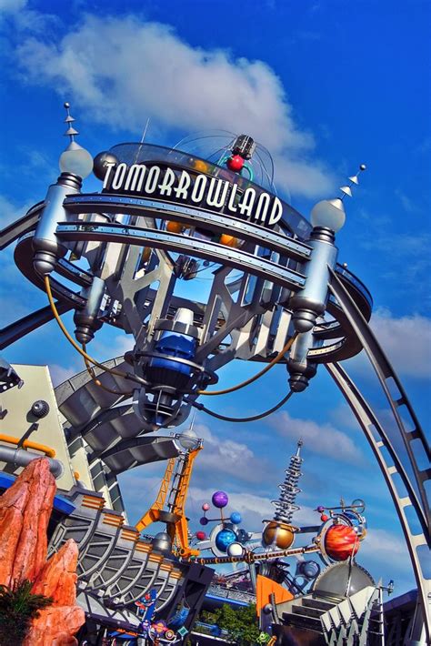 The Tomorrowland Sign In Front Of An Amusement Park