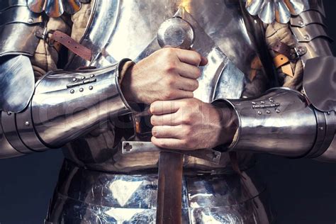 Knight Wearing Armor And Holding Two Handed Sword Stock Image Colourbox