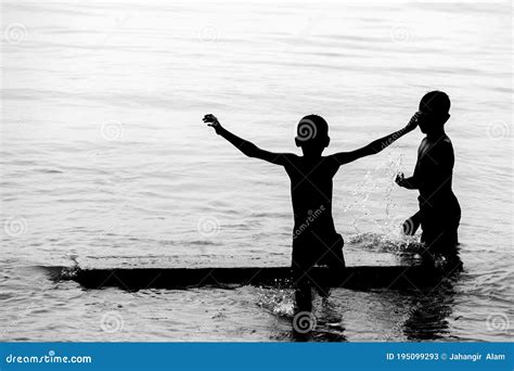 Two Boys Are Bathing On River Water And Having Fun Editorial Stock