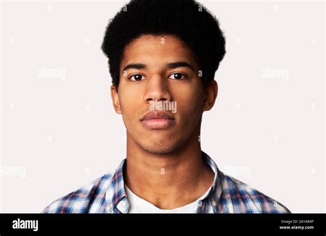 Serious African American Guy Portrait On White Background Stock Photo