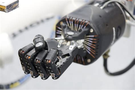 Space In Images 2010 06 An Artificial Hand For Robot Arm