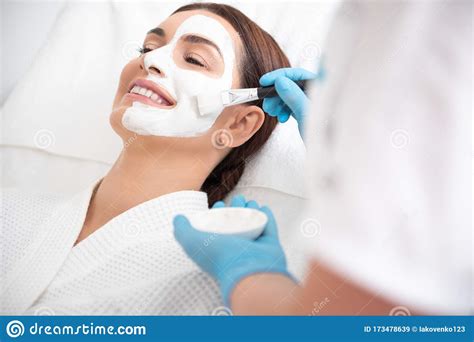 Therapist Applying Face Mask To Happy Female Stock Image Image Of Apply Indoors 173478639