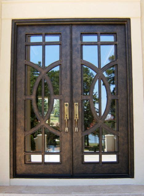 With walnut inlay accents and finished in chapparral. Contemporary Iron Double Door Clark Hall Iron Doors ...