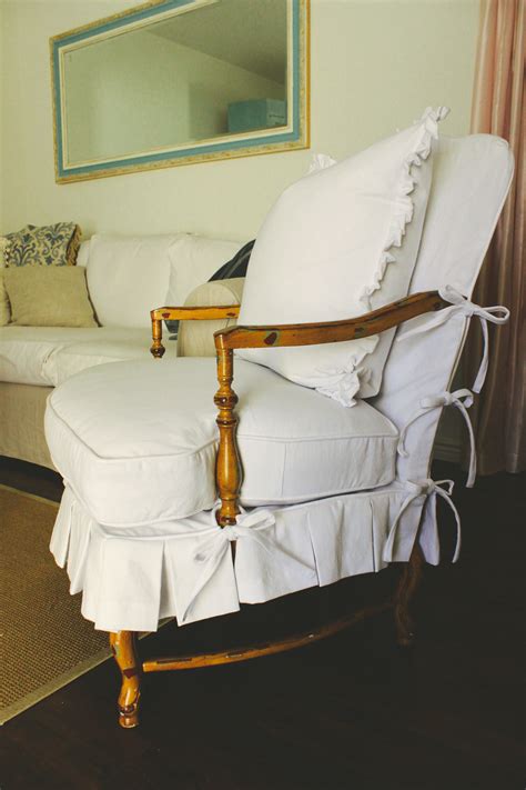 Button tufting decorates the seat and back. Custom Slipcovers by Shelley: Wood Arm Chair