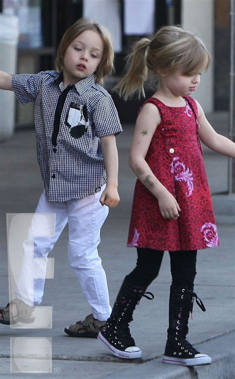Photos From Brad Pitt And Angelina Jolies Twins Play Outside