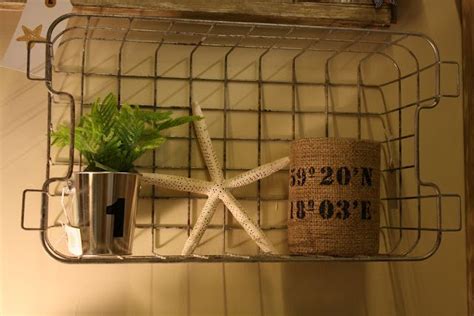 A Potted Plant Sitting On Top Of A Metal Shelf Next To A Wall Hanging