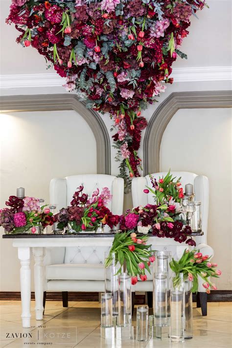 Though many different flower arrangements would work beautifully here thanks to the colorful wall art, the purple pansies really bring this bedroom to life. Marsala wedding flowers, marsala wedding color, marsala ...
