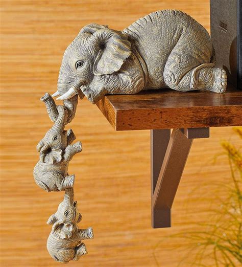 This Elephant With Hanging Baby Elephants Bookend Statue Is Just Too