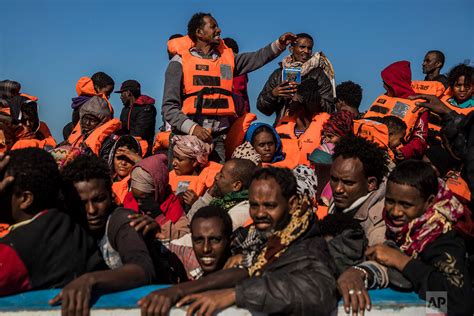 Refugees and migrants rescued off Libyan coast — AP Images ...