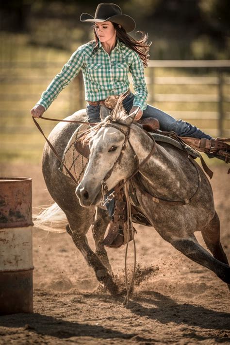 Action Photograph Of Barrel Racer Cowgirl