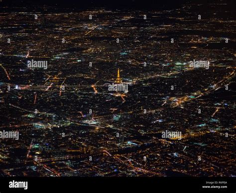 Taken From A Plane A Cityscape Of Paris By Night With The Eiffel Tower