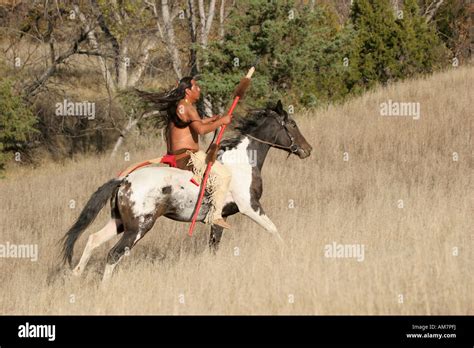 A Native American Indian Man Riding Bareback On A Horse In The Stock