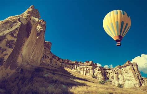 Premium Photo Hot Air Balloon Flying Over Spectacular Cappadocia