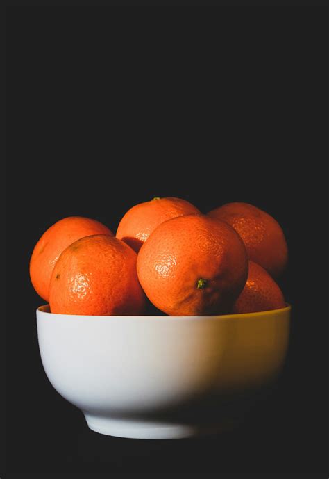 Orange Fruits On White Ceramic Bowl Photo Free Plant Image On Unsplash