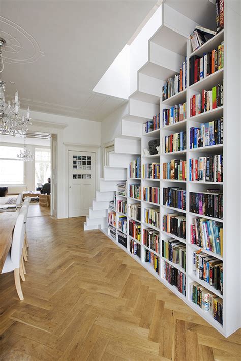 Minimalist Staircase Elegantly Frames Built In Bookshelf