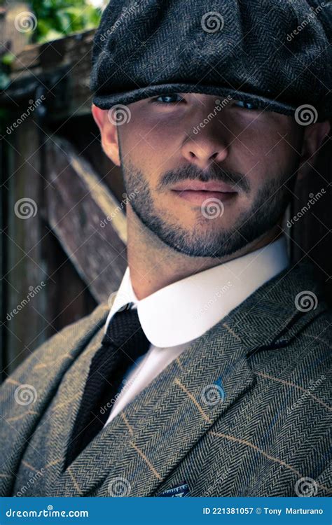 Handsome English Gangster Dressed In Waistcoat And Jacket Sitting And