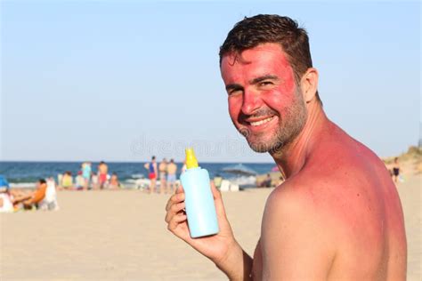 Man Showing Tanning Lotion While Getting Sunburned Stock Image Image
