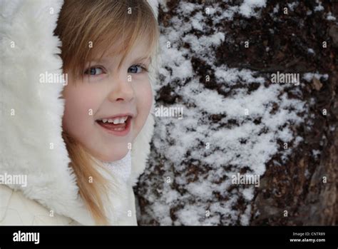 Smiling Girl Standing Outdoors In Snow Stock Photo Alamy