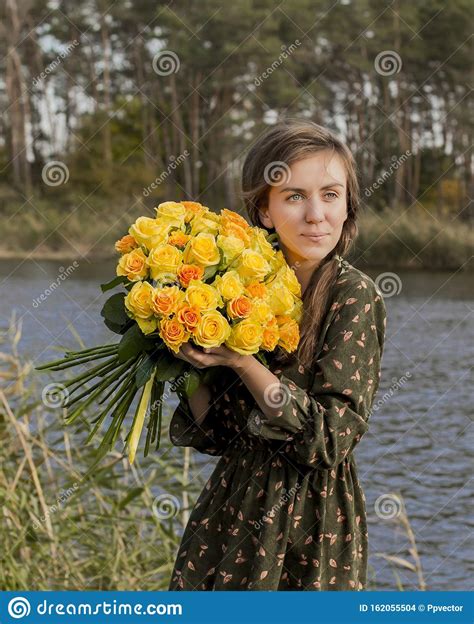Beautiful Girl With A Bouquet Of Yellow Roses Effective Woman Near The