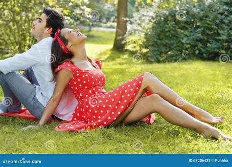 Couple In Love Lying On The Grass In The Park Stock Image Image Of