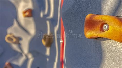 Panorama Frame Bright Orange Foothold Or Handhold Of A Climbing Wall At
