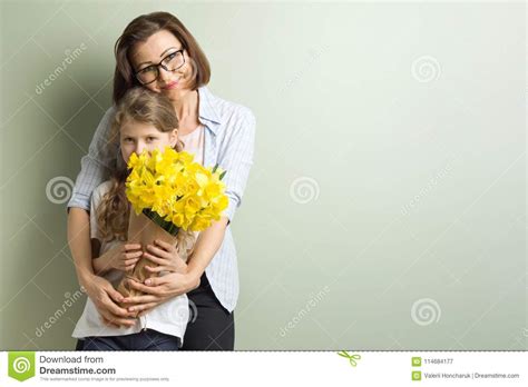 Child Congratulates Mother And Gives Her Bouquet Stock ...