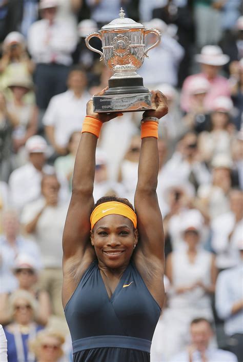 Serena Williams Holds Up Her Trophy After Defeating Maria Sharapova