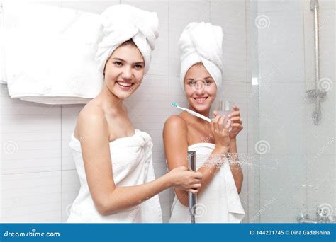 Young Beautiful Girls In The Bathroom Are Ready To Take A Shower Stock